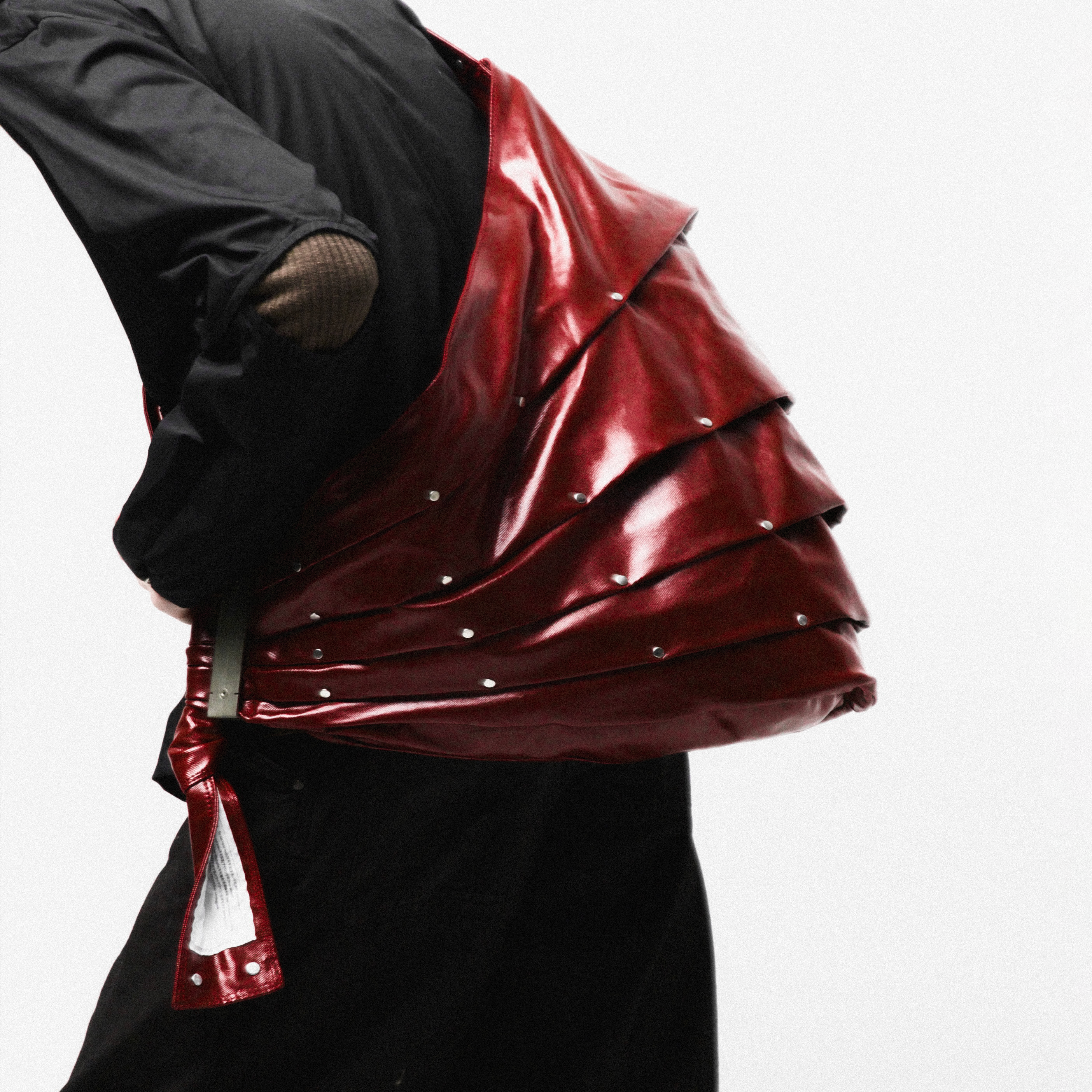 MULTI RIVET TRAMPBAG